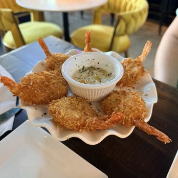 Noir Bistrot - Coconut shrimp - Tapas Bars Near Me - Mandeville, Louisiana Noir Bistrot - Coconut shrimp - Tapas Bars Near Me - Mandeville, Louisiana
