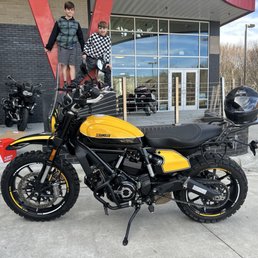 Heavily modded Ducati Scrambler Full Throttle with my boys in the background.