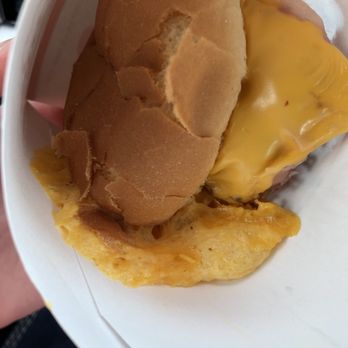 Arbys - a person holding a sandwich in a paper container - Fast Food Near Me - Bucyrus, Ohio