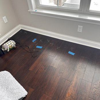 D & M Flooring America - Tape and chalk Xs denotes floor lifting. - Carpeting Near Me - Appleton, Wisconsin