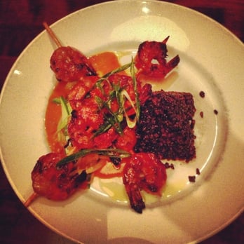 Maya Del Sol - Camarones and black rice with a curried coconut cream sauce. - Latin American Near Me - Oak Park, Illinois Maya Del Sol - Camarones and black rice with a curried coconut cream sauce. - Latin American Near Me - Oak Park, Illinois