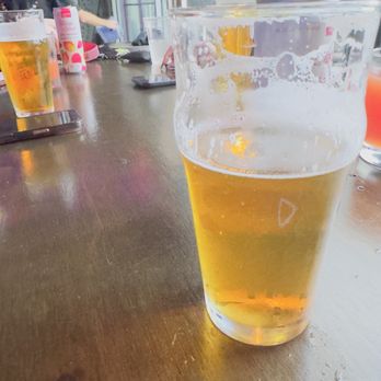 Unseen Creatures Brewing - Drinks on the table  A casual table shot with beers and seltzers exactly the kind of relaxed hangout energy this place gives. - Breweries Near Me - Miami, Florida