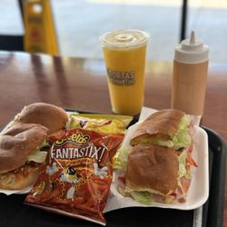 Tortas Manantial - Torta de chicharrón and Original torta with Mango juice