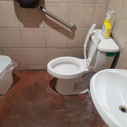Ojeda's Cafe - Clean restrooms floor is clean just stained/sealed that way