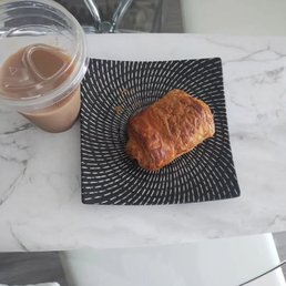 Iced Chai latte and chocolate croissant Iced Chai latte and chocolate croissant