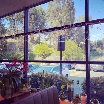 Blooming Cafe - a view of a parking lot through a window - Sushi Bars Near Me - Diamond Bar, California Blooming Cafe - a view of a parking lot through a window - Sushi Bars Near Me - Diamond Bar, California