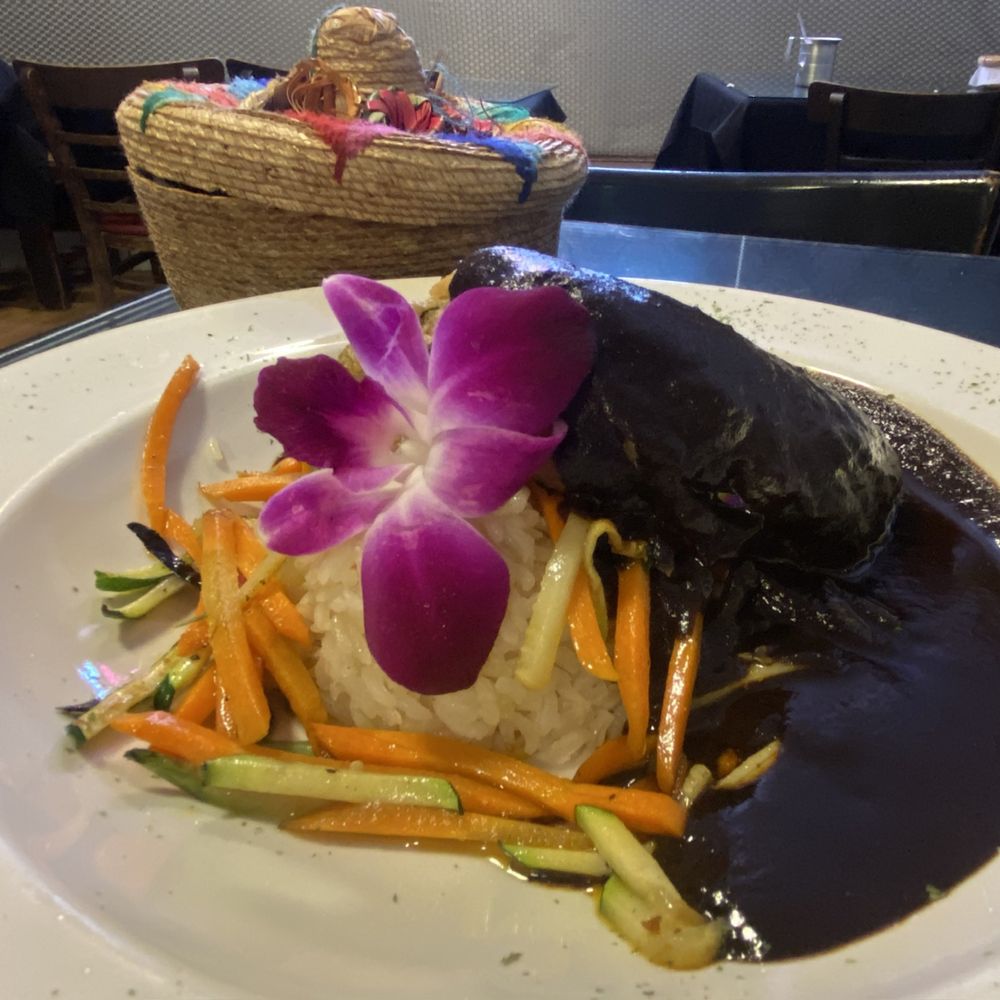 Rocio's Mexican Kitchen - Mole Oaxaqueno on top of / with chile relleno - Mexican Near Me - Bell Gardens, California Rocio's Mexican Kitchen - Mole Oaxaqueno on top of / with chile relleno - Mexican Near Me - Bell Gardens, California