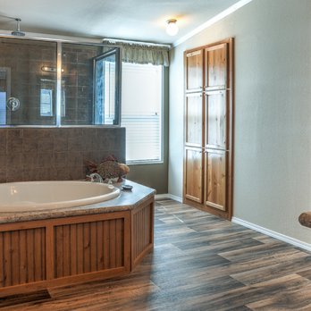 Palm Harbor Village - Your biggest decision in the Canyon Bay bath is whether to choose the giant tub or the huge shower! - Mobile Home Dealers Near Me - Seguin, Texas Palm Harbor Village - Your biggest decision in the Canyon Bay bath is whether to choose the giant tub or the huge shower! - Mobile Home Dealers Near Me - Seguin, Texas