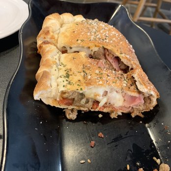 Coop's Pizzeria - a half eaten pizza - Pizza Near Me - Salina, Kansas Coop's Pizzeria - a half eaten pizza - Pizza Near Me - Salina, Kansas