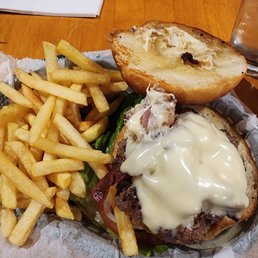Burger with bacon and American cheese with a side of fries. Burger with bacon and American cheese with a side of fries.