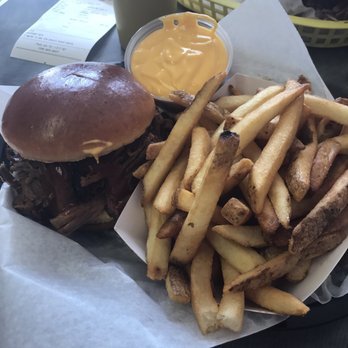 Porky's BBQ - Brisket sandwich with a side of cheese fries. - Barbeque Near Me - Arlington Heights, Illinois