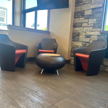 Dunkin' -  two chairs and a coffee table in a waiting area - Donuts Near Me - Painted Post, New York