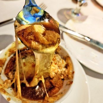 Ocean Prime - The success of an Onion Soup is directly related to the length of the cheesy strings. - Seafood Near Me - Naples, Florida Ocean Prime - The success of an Onion Soup is directly related to the length of the cheesy strings. - Seafood Near Me - Naples, Florida