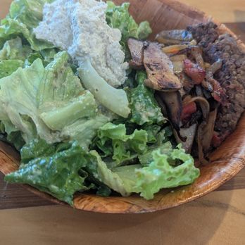 Sweet Cane Cafe - HUNGRY FARMER - Greens in caesar dressing, house made burger patty, sautéed veggies & mac nut spread..I got the black bean burger patty - Sandwiches Near Me - Hilo, Hawaii