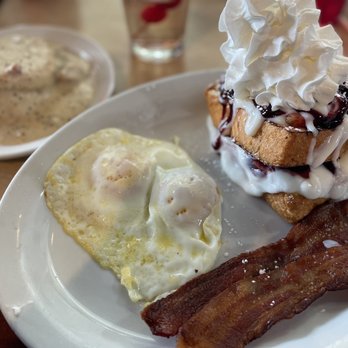 Butters Breakfast & Lunch - Butters XL with bacon, stuffed French toast, and a side of biscuits and gravy - Breakfast & Brunch Near Me - Greeley, Colorado Butters Breakfast & Lunch - Butters XL with bacon, stuffed French toast, and a side of biscuits and gravy - Breakfast & Brunch Near Me - Greeley, Colorado