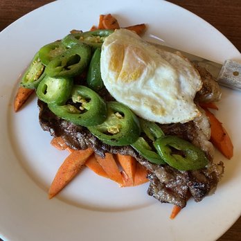 Manny's Steakhouse - 12oz ribeye-medium rare over bed of carrots with grilled jalapeño and a fried egg - Steakhouses Near Me - Vallejo, California Manny's Steakhouse - 12oz ribeye-medium rare over bed of carrots with grilled jalapeño and a fried egg - Steakhouses Near Me - Vallejo, California