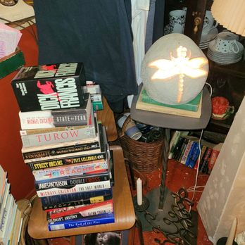 Detroit Vintage - a stack of books and a lamp - Coffee & Tea Near Me - Detroit, Michigan