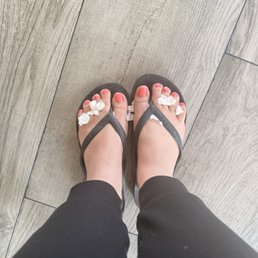 Pedicure with a bright orange polish, regular nail lacquer. Pedicure with a bright orange polish, regular nail lacquer.