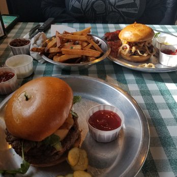 Rodeo Goat - In the picture the burger closest to you is The Impossible burger with double plant-based not meat - Burgers Near Me - Dallas, Texas Rodeo Goat - In the picture the burger closest to you is The Impossible burger with double plant-based not meat - Burgers Near Me - Dallas, Texas