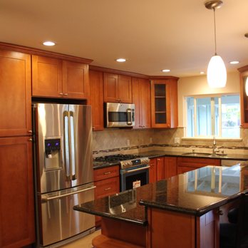Tedac Construction - a kitchen with stainless steel appliances - General Contractors Near Me Tedac Construction - a kitchen with stainless steel appliances - General Contractors Near Me