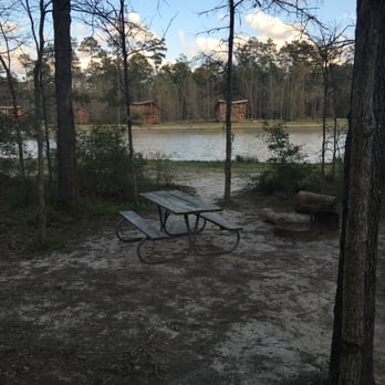 Lake Houston Wilderness Park - View from the front porch of an A-Frame. Lake cabins in the distance. - Parks Near Me - New Caney, Texas Lake Houston Wilderness Park - View from the front porch of an A-Frame. Lake cabins in the distance. - Parks Near Me - New Caney, Texas