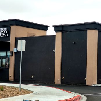 The Human Bean - Building - Exterior view of The Human Bean coffee stand in Albuquerque, NM, featuring drive-thru windows on both sides and a black and tan color scheme. - Coffee & Tea Near Me - Albuquerque, New Mexico