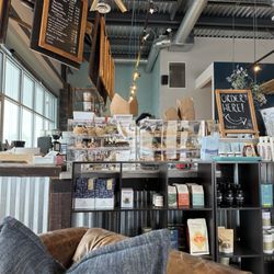 Annie's Coffee and Creamery - Inside coffee bar ordering area, baked goods & menus. Tons of flavorings and milks for your coffee too