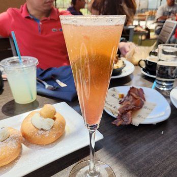 Hash Kitchen - Kiwi mimosa with glitter bomb - Breakfast & Brunch Near Me - Chandler, Arizona Hash Kitchen - Kiwi mimosa with glitter bomb - Breakfast & Brunch Near Me - Chandler, Arizona
