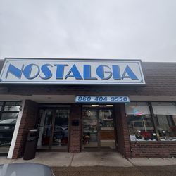 Nostalgia - Take-Out open 11-9pm. They have pizza by the slice.