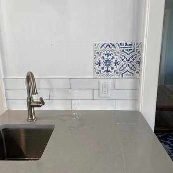 Master Tile & Painting - a kitchen counter with a sink - Flooring Near Me Master Tile & Painting - a kitchen counter with a sink - Flooring Near Me