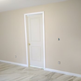 ARP X Solutions - an empty room with a door - General Contractors Near Me ARP X Solutions - an empty room with a door - General Contractors Near Me