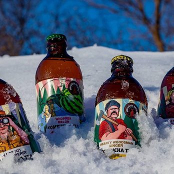 Bootlegger Brewing - four bottles of beer in the snow - Specialty Food Near Me - Apple Valley, Minnesota