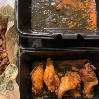 Wingstop - two trays of food on a table - Chicken Wings Near Me - Laveen, Arizona