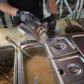 Tacos El Alcon - a person preparing food - Tacos Near Me - Los Angeles, California