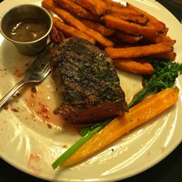 a plate of steak and sweet potato fries