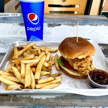 Captain's Catch - Crispy Chicken Sandwich with fries, iced tea and famous Captain's Garlic Sauce (2 oz) - Seafood Near Me - Greensboro, North Carolina Captain's Catch - Crispy Chicken Sandwich with fries, iced tea and famous Captain's Garlic Sauce (2 oz) - Seafood Near Me - Greensboro, North Carolina