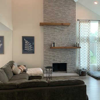 Real Deal Cabinets - Fireplace Upgrade w/ Floor to Ceiling Stacked Stone & Pine Mantle (After) - Cabinetry Near Me - Vista, California Real Deal Cabinets - Fireplace Upgrade w/ Floor to Ceiling Stacked Stone & Pine Mantle (After) - Cabinetry Near Me - Vista, California