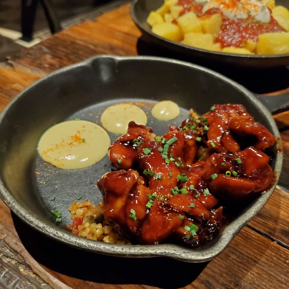 Perro Viejo - Yakitori chicken with sautéed bulgur and Peruvian aji sauce - Tapas Bars Near Me - Seville, SE Perro Viejo - Yakitori chicken with sautéed bulgur and Peruvian aji sauce - Tapas Bars Near Me - Seville, SE