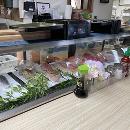 a sushi counter in a japanese restaurant
