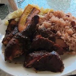 Jamaican Reggae Vibes Kitchen - Jerk Chicken and jerk pork and rice and peas