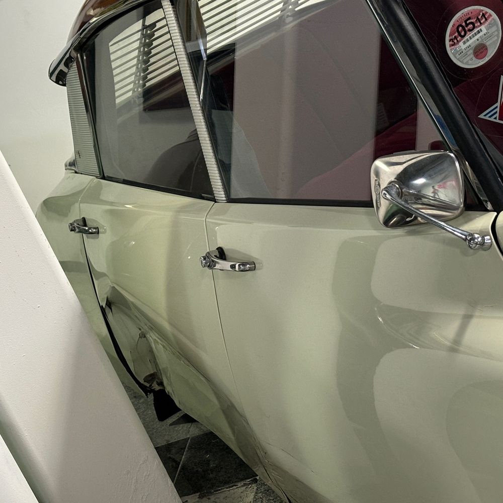 Citroen DS21 with a big bash to its rear door. Is that the kind of stuff you want to see at a car museum?