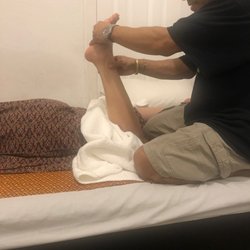 Lao Thai Massage - Foot massage to relieve the tightness in your legs.