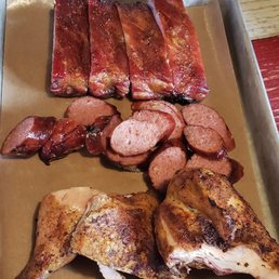 Ribs, sausage, and roast chicken. Ribs, sausage, and roast chicken.