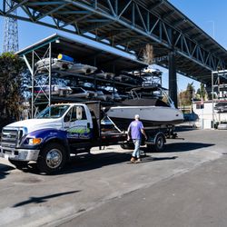 Seattle Boat Company - Truck towing boat into Seattle Boat Main Location