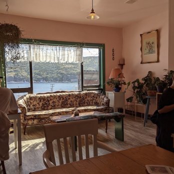 Toslow - a living room with a view of a lake - Coffee & Tea Near Me - St. John's, Newfoundland and Labrador