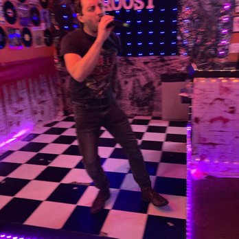 The Canary Roost - a man on a checkered floor - Karaoke Near Me - Austin, Texas The Canary Roost - a man on a checkered floor - Karaoke Near Me - Austin, Texas