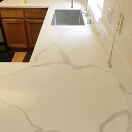 Replacement of Only Countertops, Sink, Faucet, Garbage Disposal.
