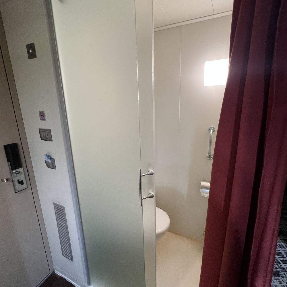 Norwegian Cruise Lines - Toilet area across from shower stall and adjacent to cabin door. - Boat Tours Near Me - Seattle, Washington Norwegian Cruise Lines - Toilet area across from shower stall and adjacent to cabin door. - Boat Tours Near Me - Seattle, Washington