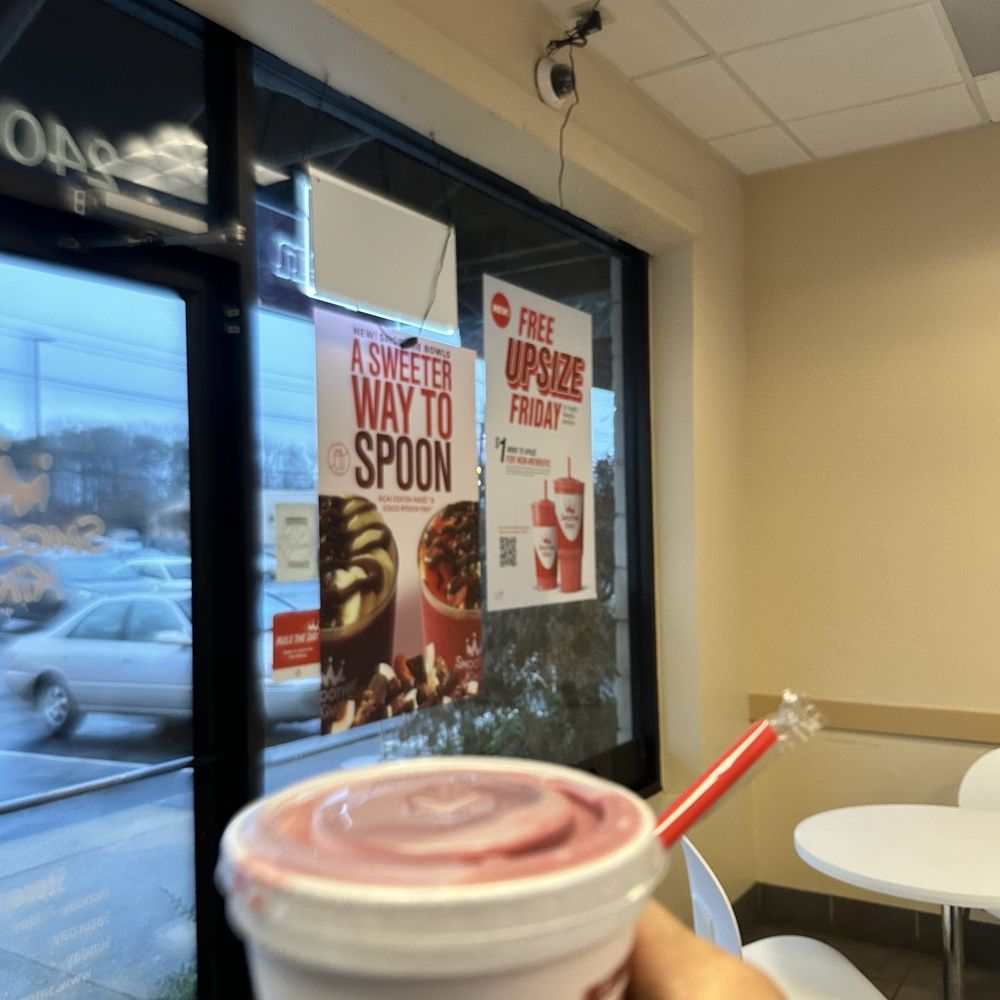 Smoothie King - a hand holding a cup of smoothie - Juice Bars & Smoothies Near Me - Greensboro, North Carolina Smoothie King - a hand holding a cup of smoothie - Juice Bars & Smoothies Near Me - Greensboro, North Carolina