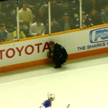 San Jose Sharks - 10-5-06: Worker patches a hole along the boards. - Professional Sports Teams Near Me - San Jose, California San Jose Sharks - 10-5-06: Worker patches a hole along the boards. - Professional Sports Teams Near Me - San Jose, California